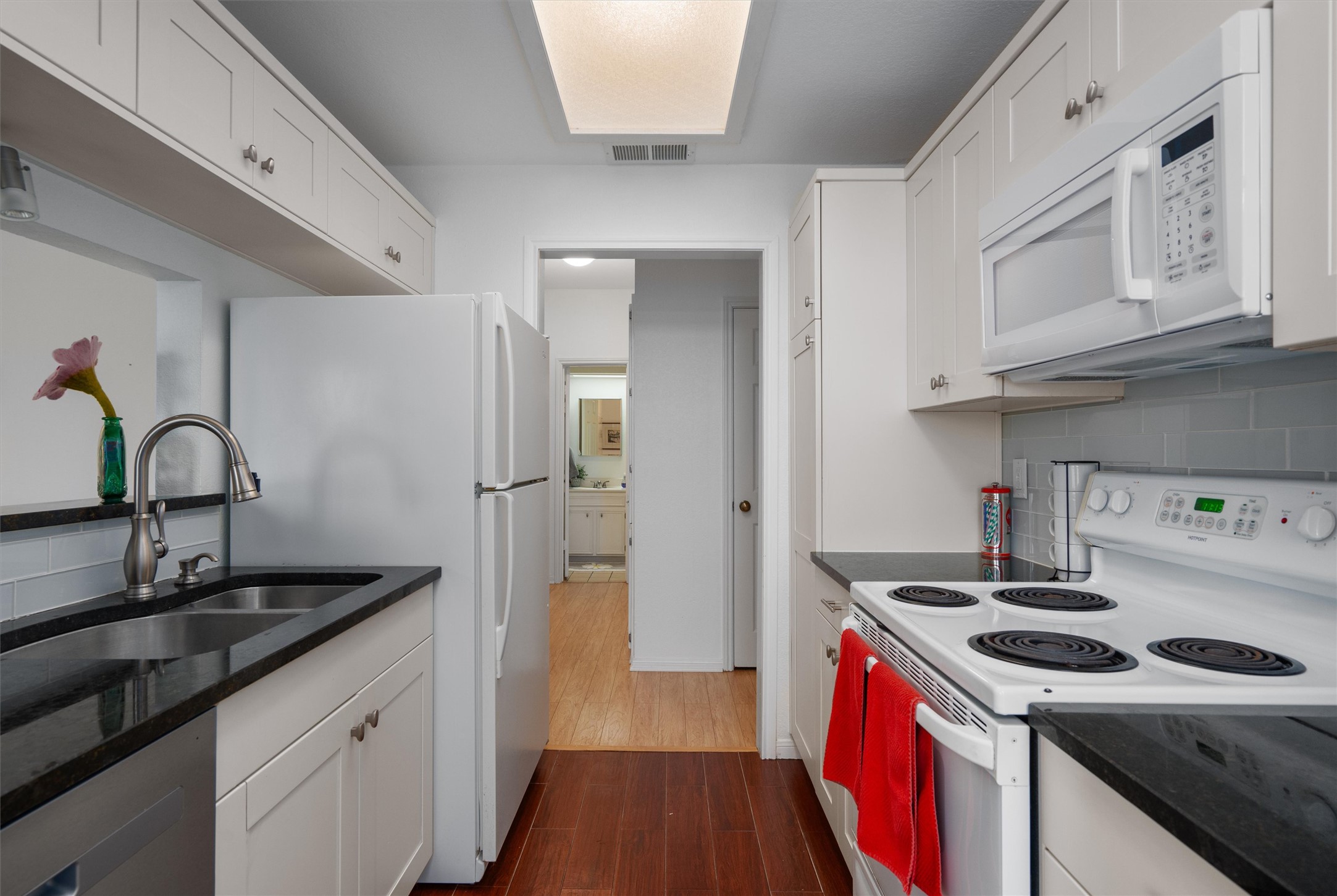 3840 Far W Boulevard, Unit 206 Austin, TX 78731 - Photo 8 of 20 The kitchen is practical and clean with granite counters and a breakfast bar.