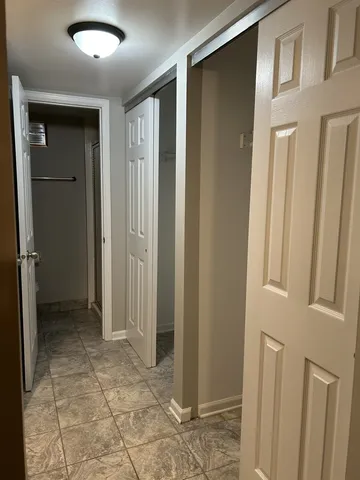 a view of a hallway with closet area