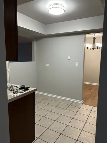 a kitchen with a sink and a refrigerator