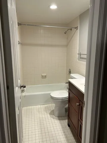 a bathroom with a toilet a sink and bathtub