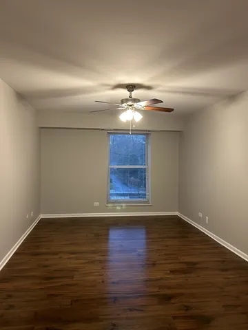 a view of room with wooden floor