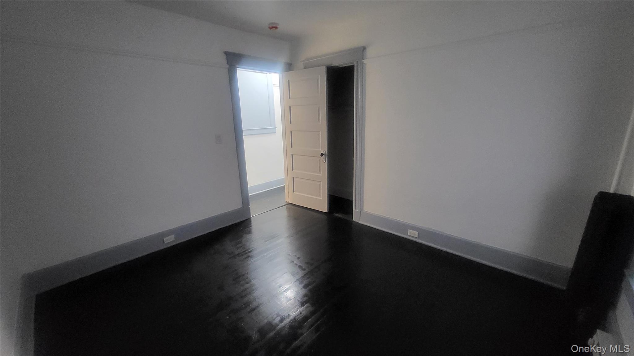 76 South Hamilton Street, Unit 2 Poughkeepsie, NY 12601 - Photo 14 of 19 a view of an empty room with wooden floor and a window