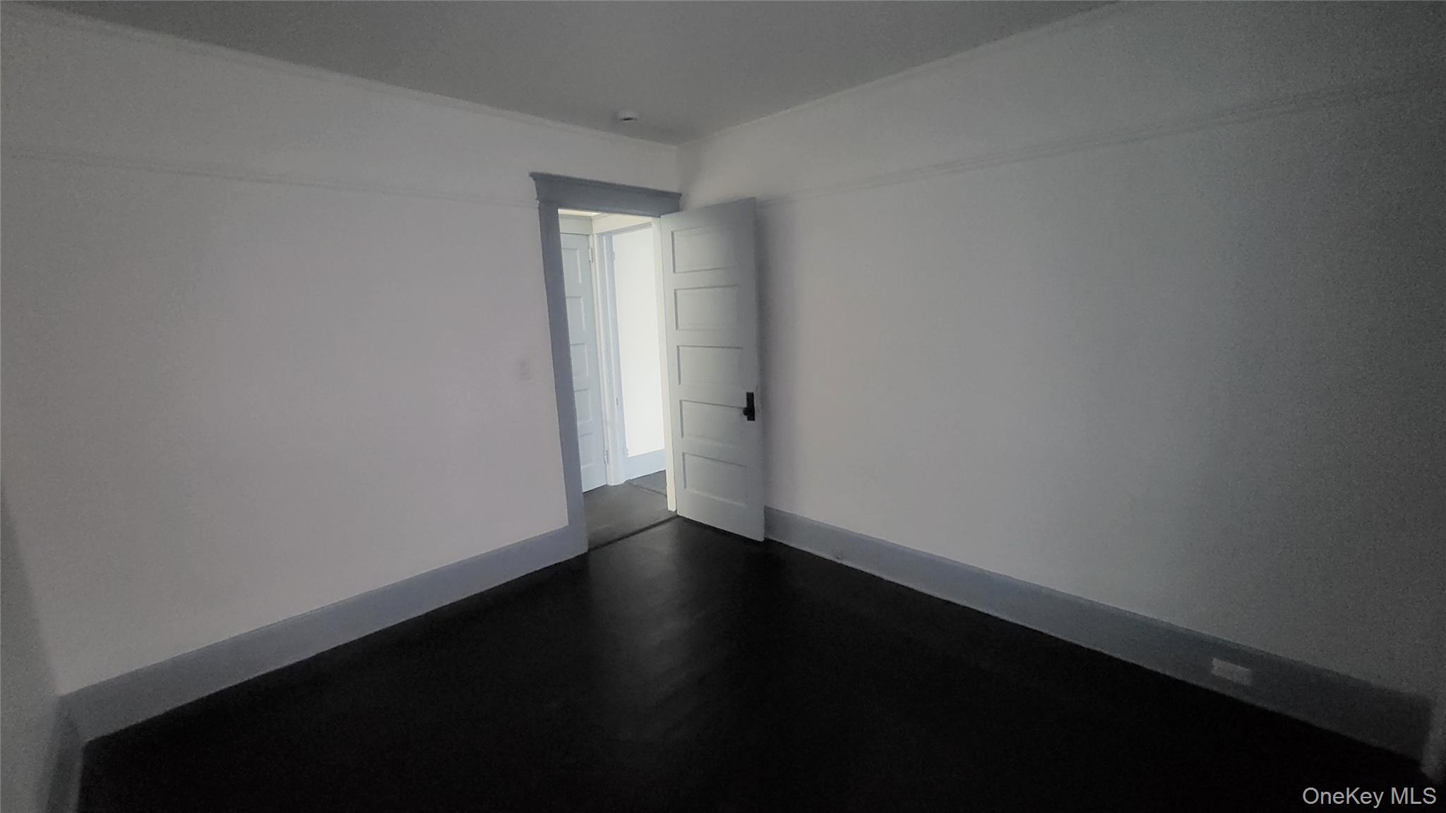 76 South Hamilton Street, Unit 2 Poughkeepsie, NY 12601 - Photo 16 of 19 a view of an empty room with wooden floor and a window