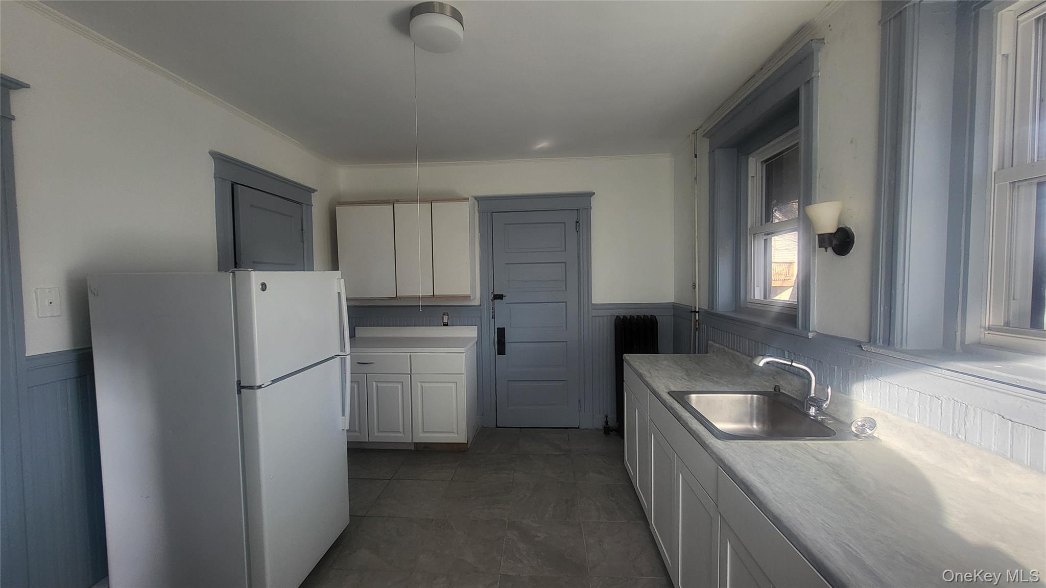 76 South Hamilton Street, Unit 2 Poughkeepsie, NY 12601 - Photo 3 of 19 a kitchen with a refrigerator sink and cabinets