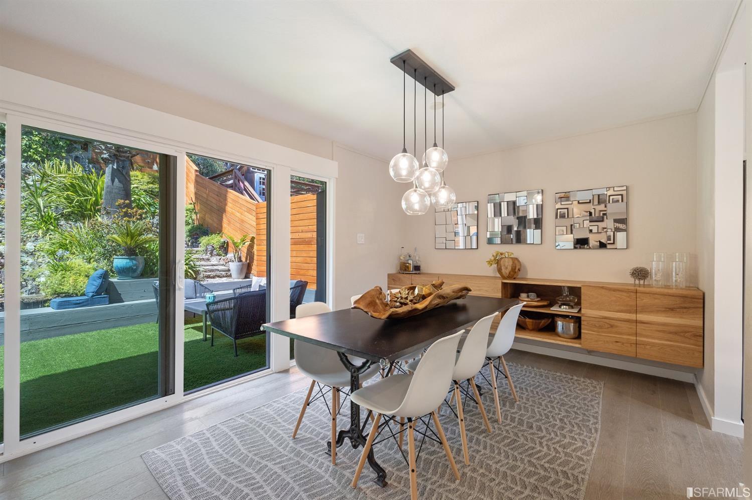 66 Amethyst Way San Francisco, CA 94131 - Photo 15 of 62 The main living and dining area open directly to the lush and inviting rear garden.