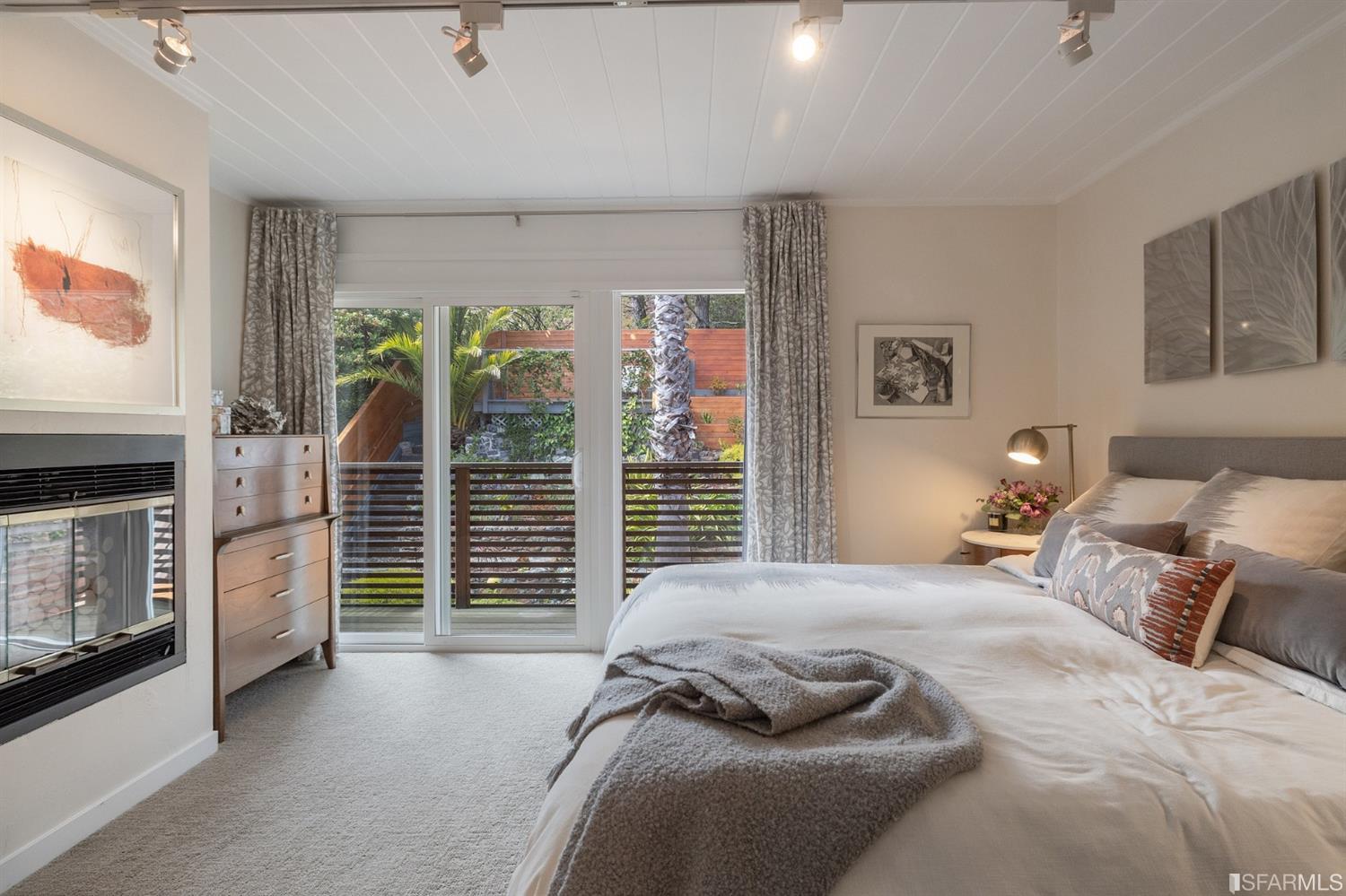 66 Amethyst Way San Francisco, CA 94131 - Photo 35 of 62 The primary suite features a fireplace and balcony overlooking the garden.