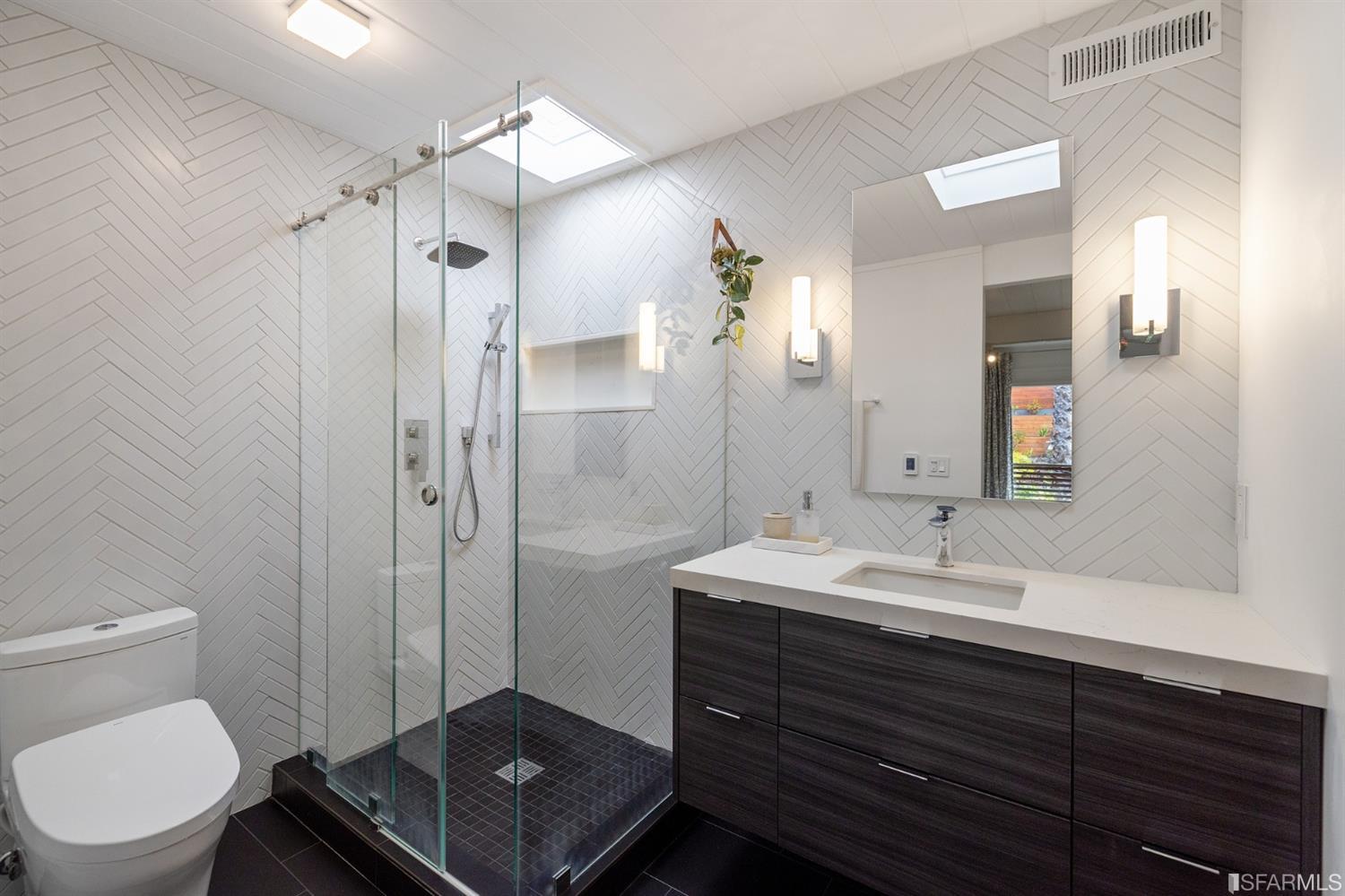 66 Amethyst Way San Francisco, CA 94131 - Photo 39 of 62 The primary en-suite bath has been tastefully remodeled, and includes a walk-in closet (not pictured).