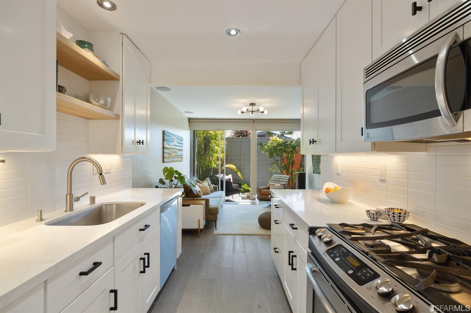 66 Amethyst Way San Francisco, CA 94131 - Photo 10 of 62 The beautifully-remodeled galley kitchen features gorgeous counters, cabinetry and stainless appliances.