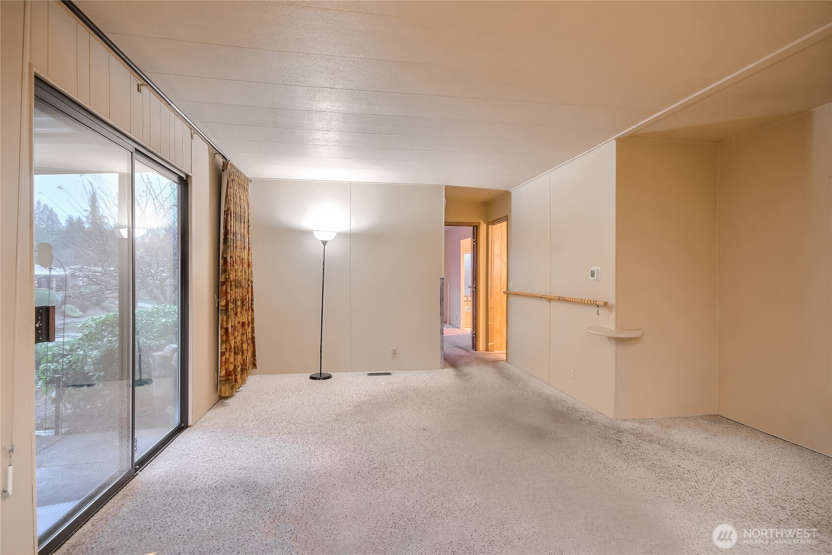 201 Union Avenue Southeast, Unit 112 Renton, WA 98059 - Photo 12 of 35 a view of an empty room with glass door