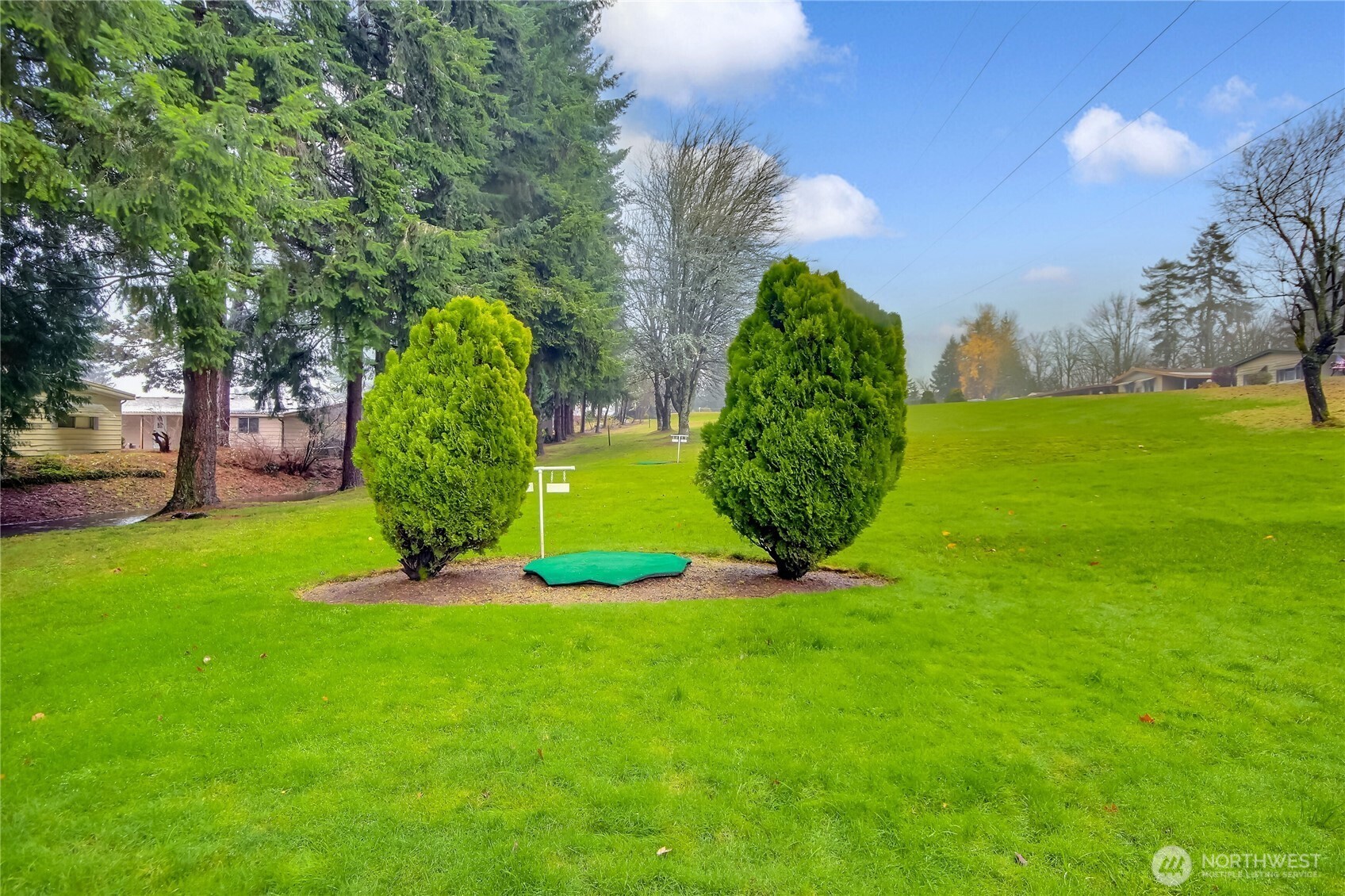 201 Union Avenue Southeast, Unit 112 Renton, WA 98059 - Photo 30 of 35 a view of a garden with a building in the background