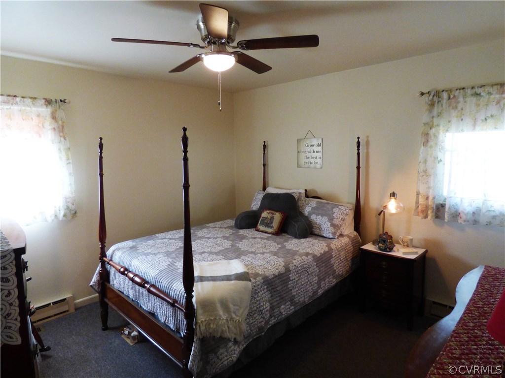 921 Yorkshire Road Colonial Heights, VA 23834 - Photo 12 of 22 a bedroom with a bed and a chandelier