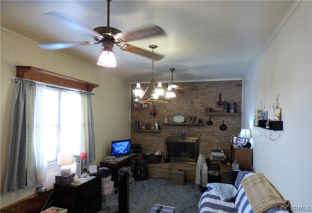 921 Yorkshire Road Colonial Heights, VA 23834 - Photo 10 of 22 a living room with furniture a fireplace and a chandelier