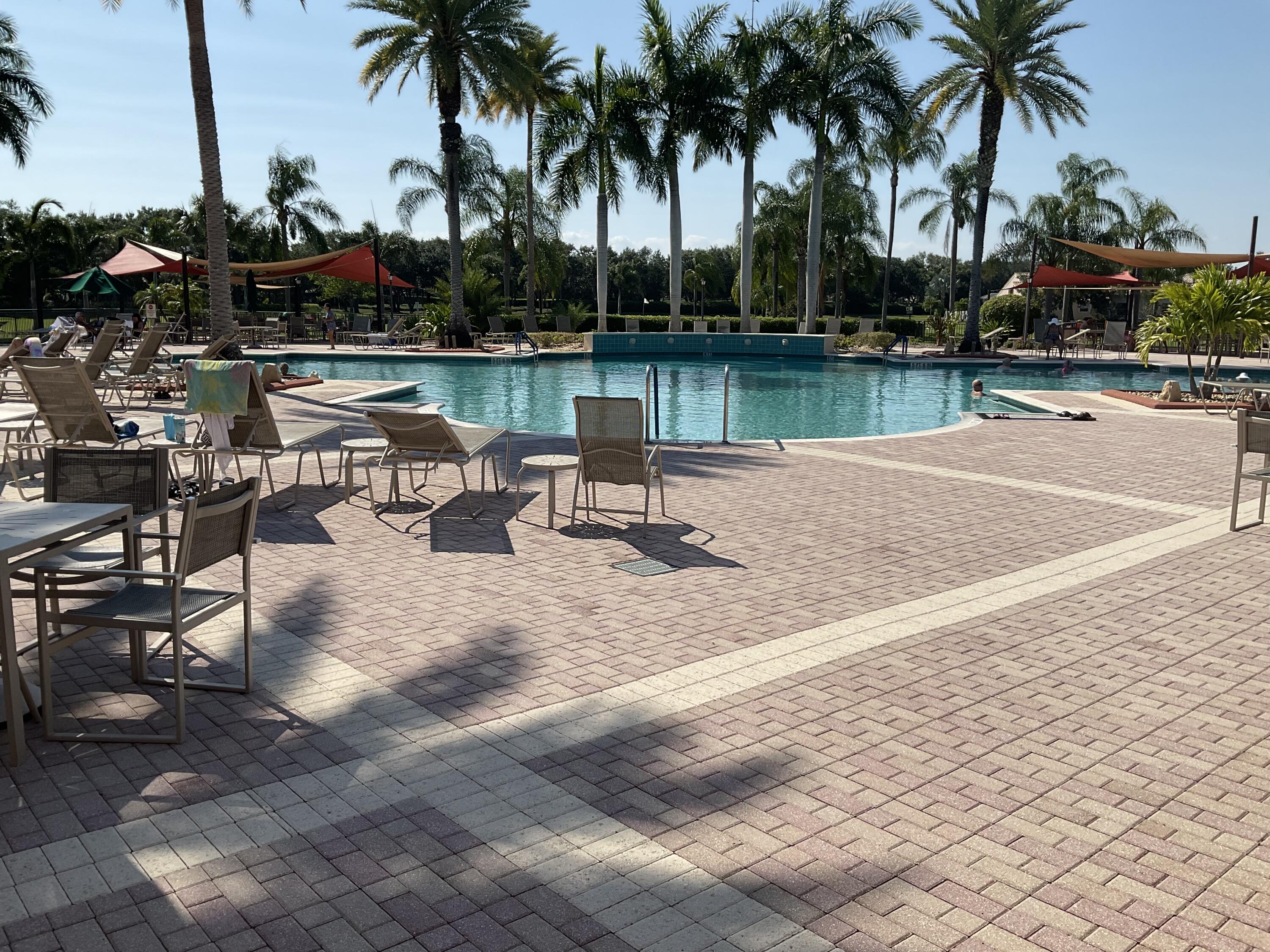 364 Sunview Way Port St. Lucie, FL 34986 - Photo 25 of 34 a bench sitting in the middle of a lake