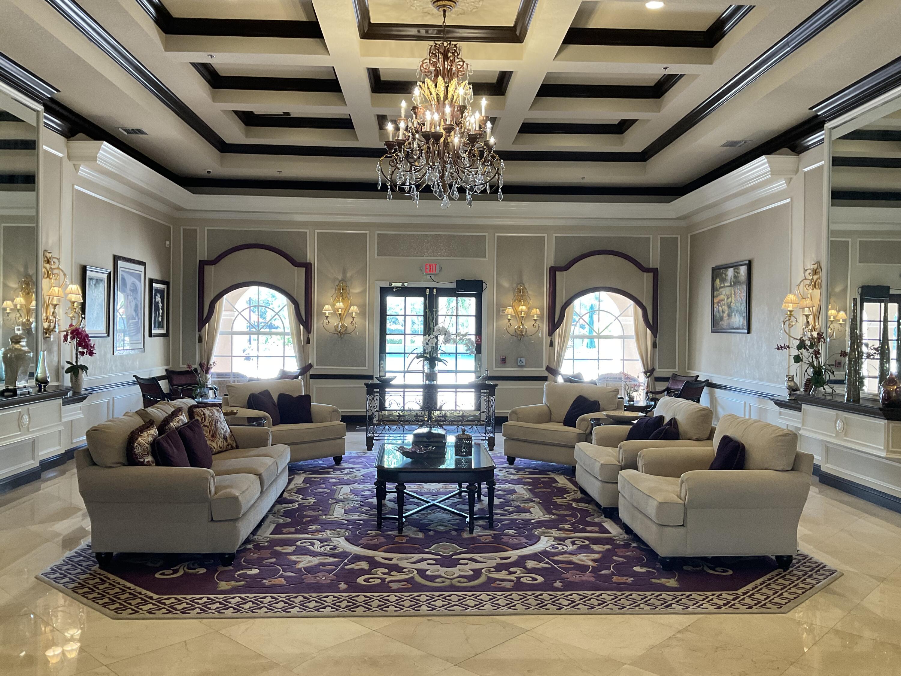 364 Sunview Way Port St. Lucie, FL 34986 - Photo 28 of 34 a living room with fireplace furniture and a chandelier