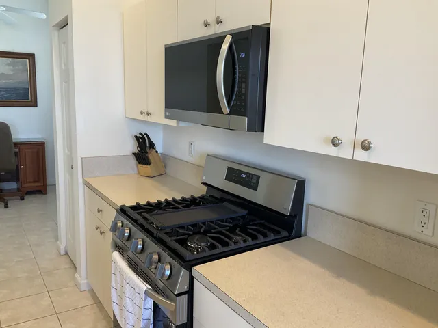 a kitchen with a stove and a microwave