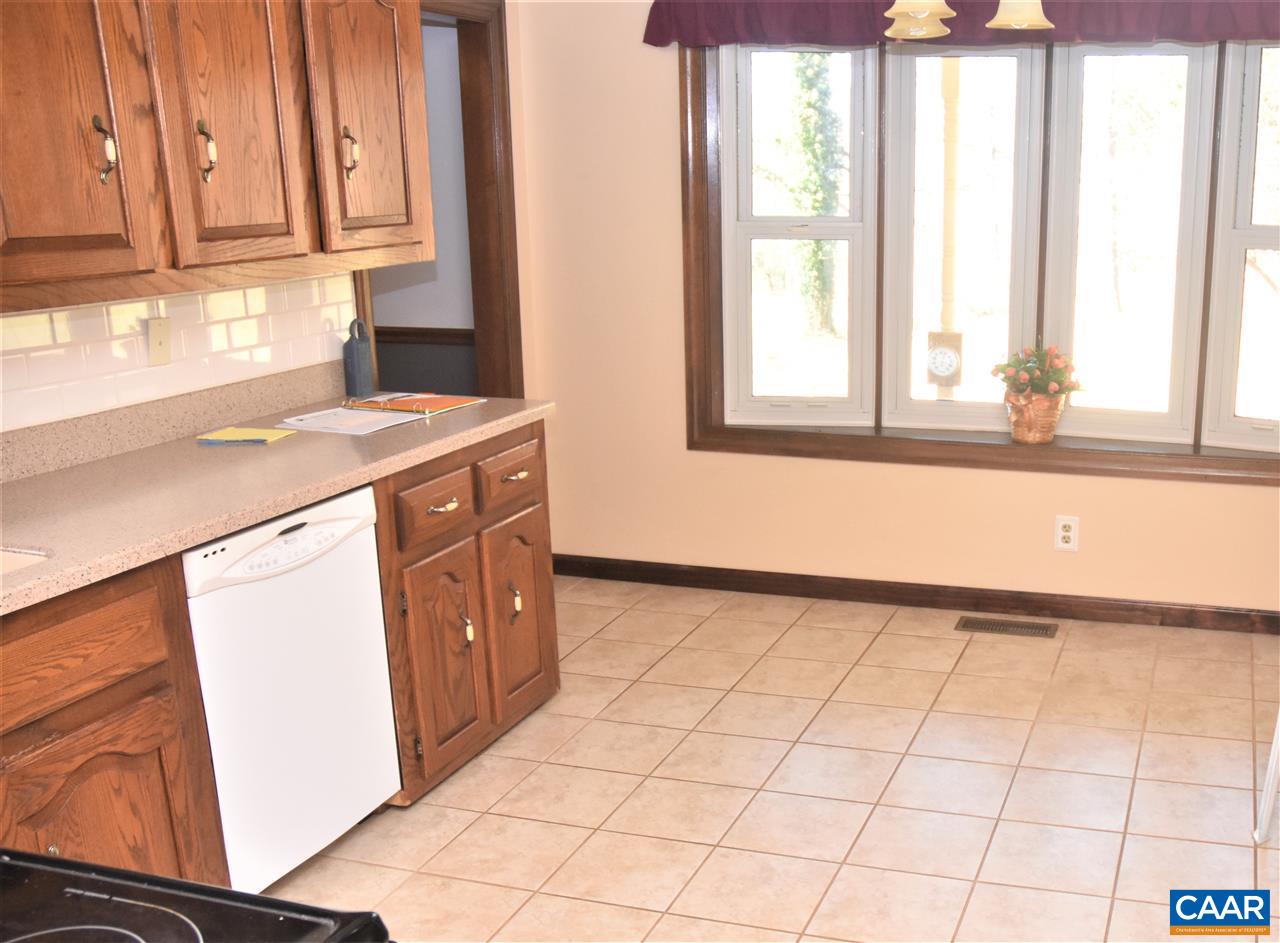 4193 Celt Road Stanardsville, VA 22973 - Photo 12 of 35 a kitchen with a stove a sink and a window