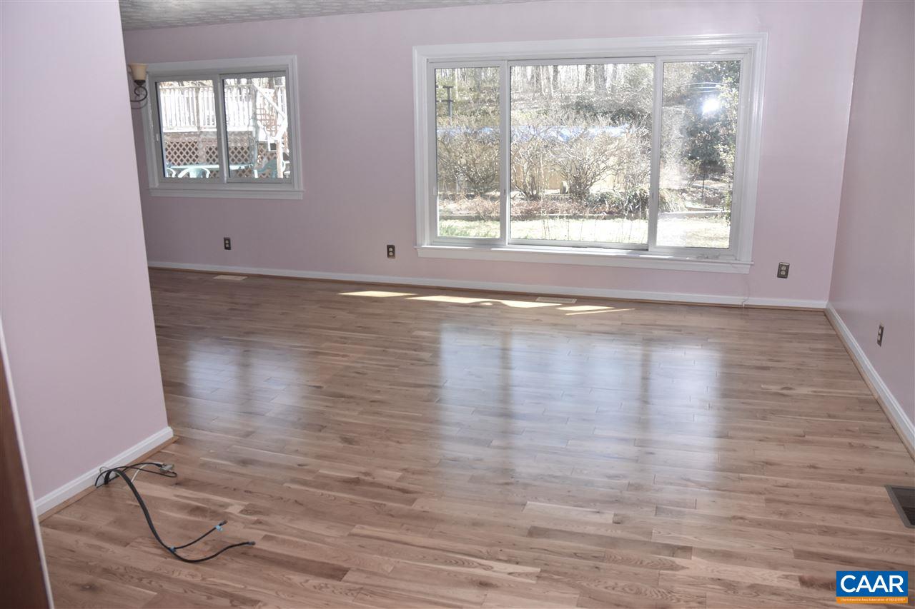 4193 Celt Road Stanardsville, VA 22973 - Photo 14 of 35 a view of empty room with wooden floor and fan