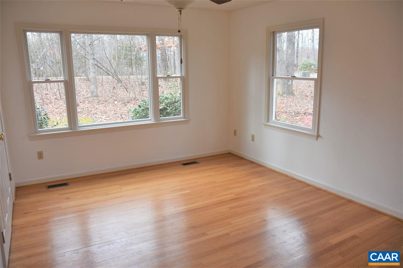 4193 Celt Road Stanardsville, VA 22973 - Photo 16 of 35 an empty room with wooden floor and windows