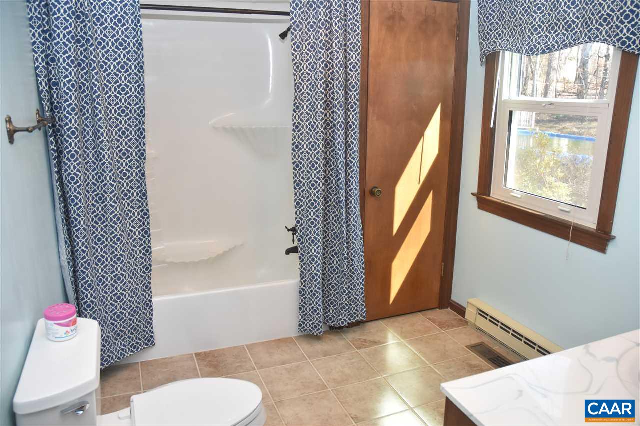 4193 Celt Road Stanardsville, VA 22973 - Photo 23 of 35 a bathroom with a sink toilet and shower