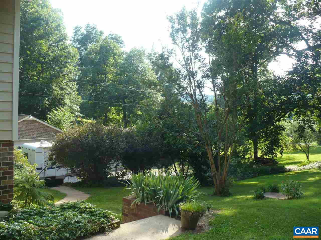 4193 Celt Road Stanardsville, VA 22973 - Photo 9 of 35 a view of a garden with a bench