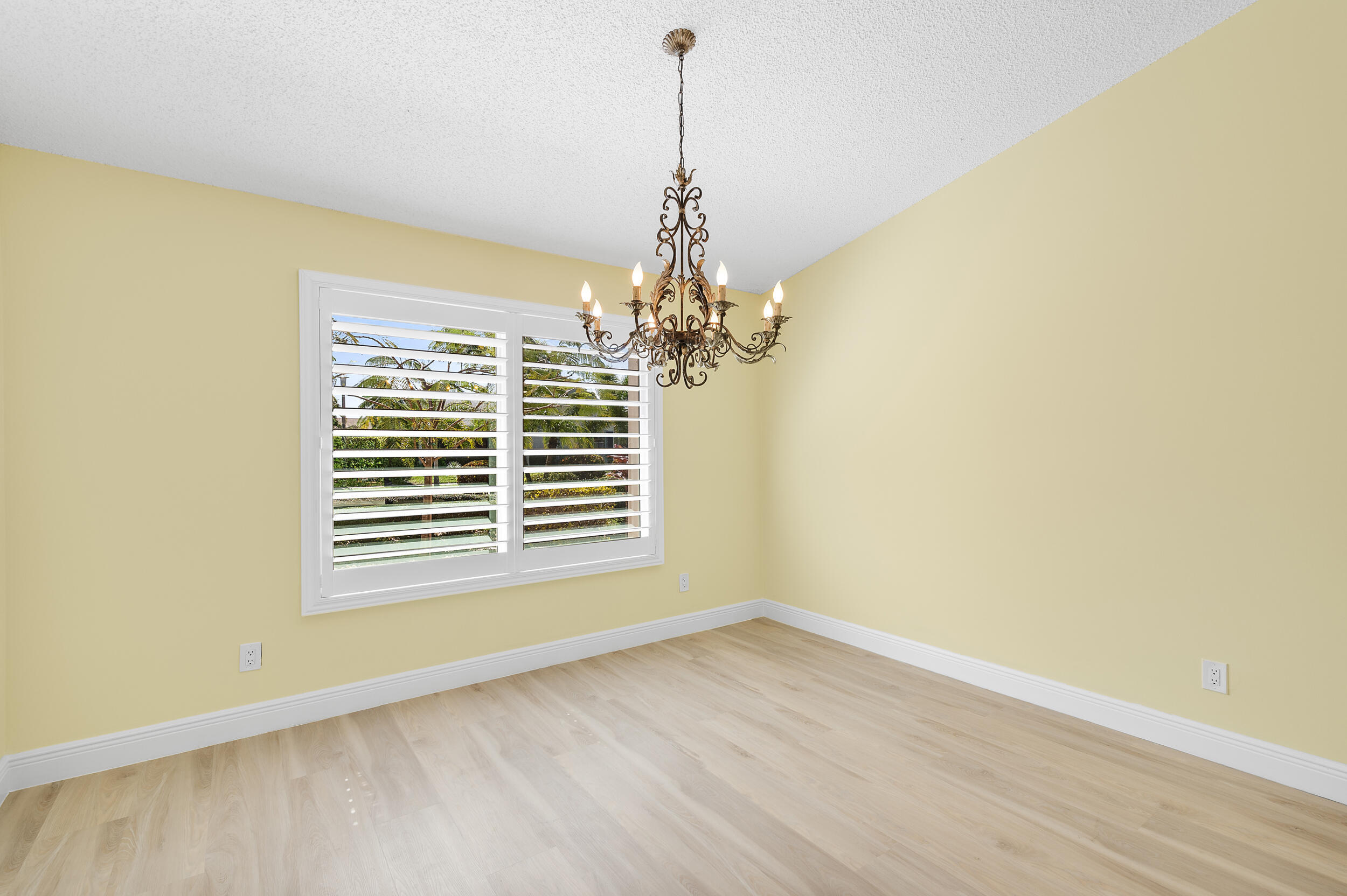 2685 Riviera Drive Delray Beach, FL 33445 - Photo 13 of 48 a view of empty room with wooden floor and fan