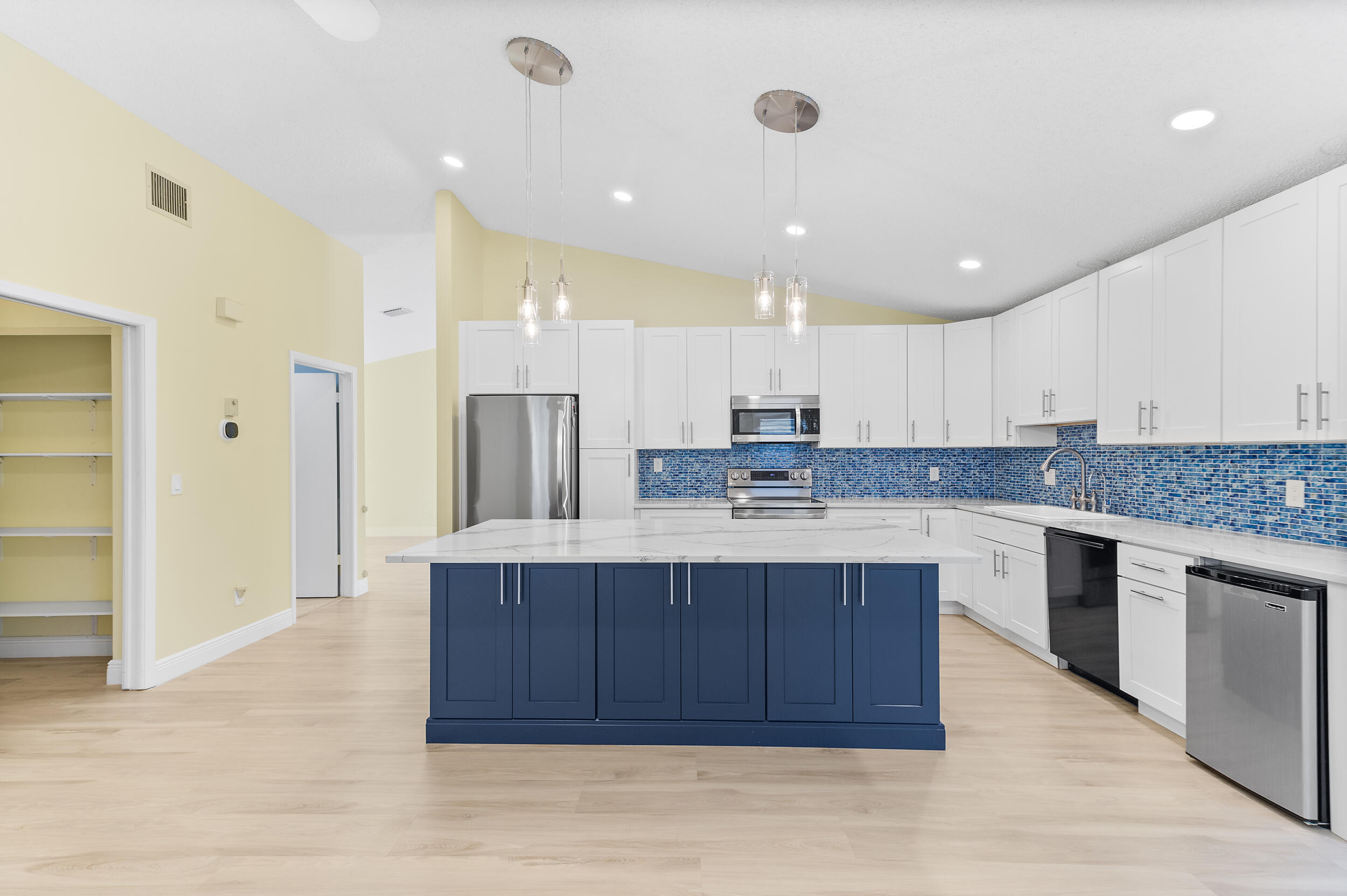 2685 Riviera Drive Delray Beach, FL 33445 - Photo 14 of 48 a kitchen with a sink and cabinets