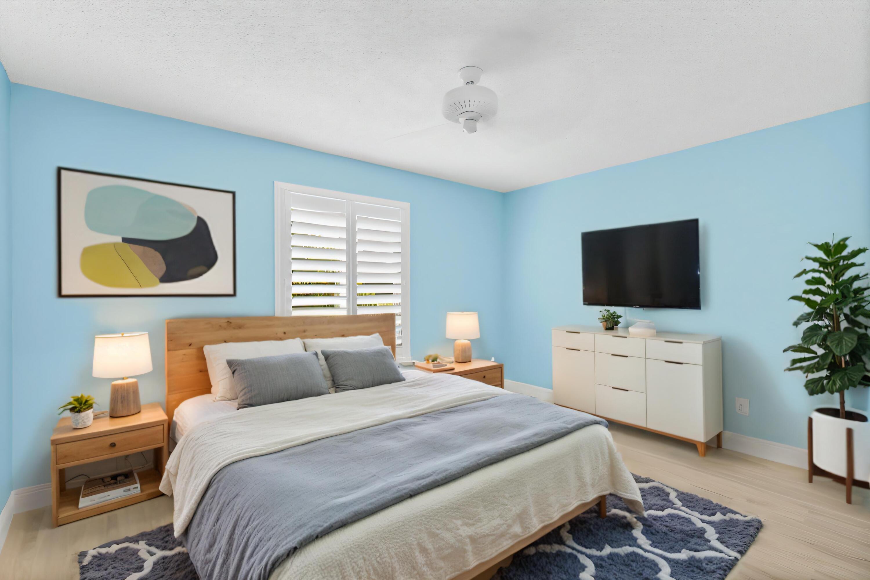 2685 Riviera Drive Delray Beach, FL 33445 - Photo 22 of 48 a bedroom with a bed and a flat screen tv