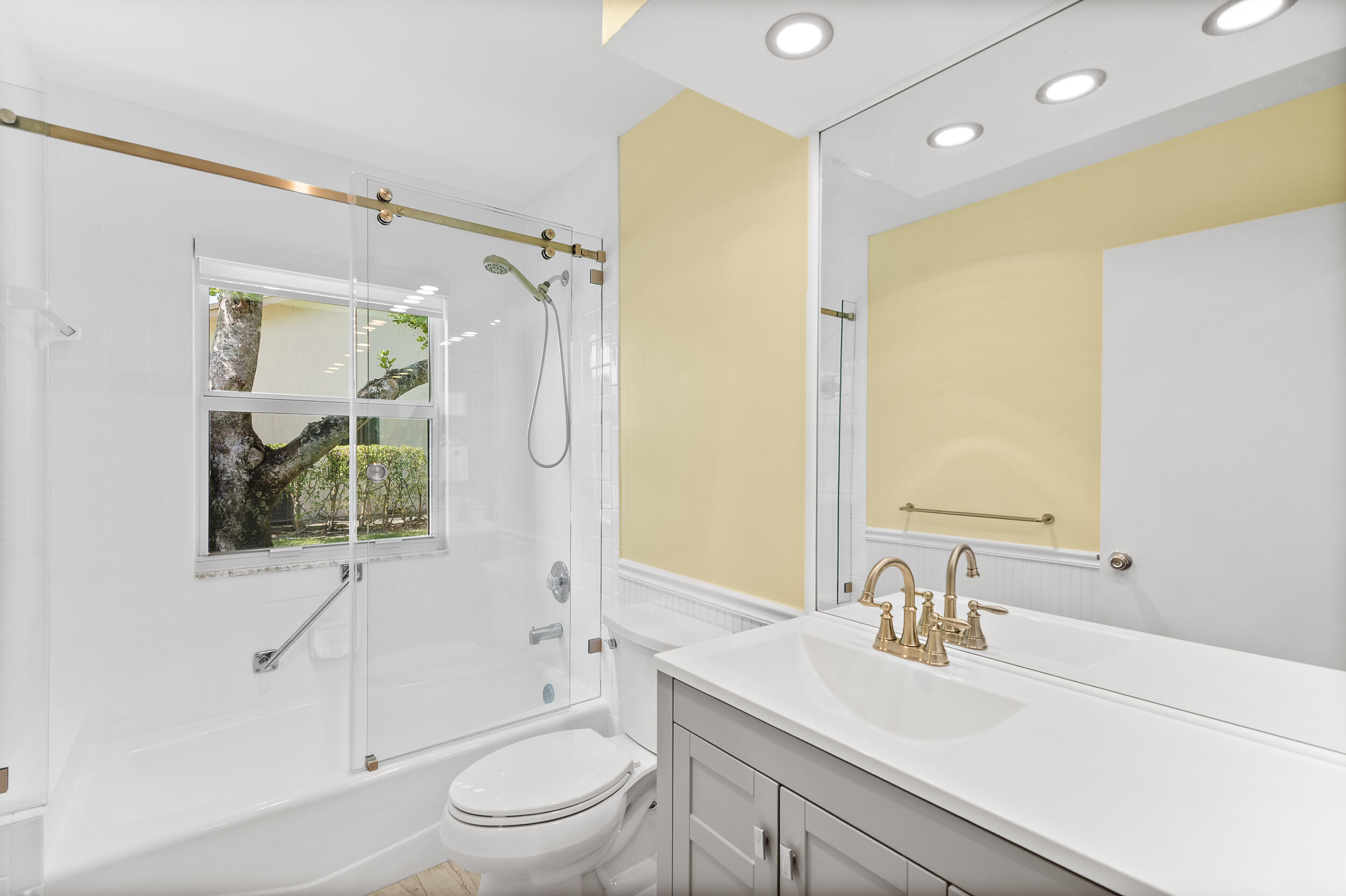 2685 Riviera Drive Delray Beach, FL 33445 - Photo 26 of 48 a bathroom with a granite countertop sink toilet and shower