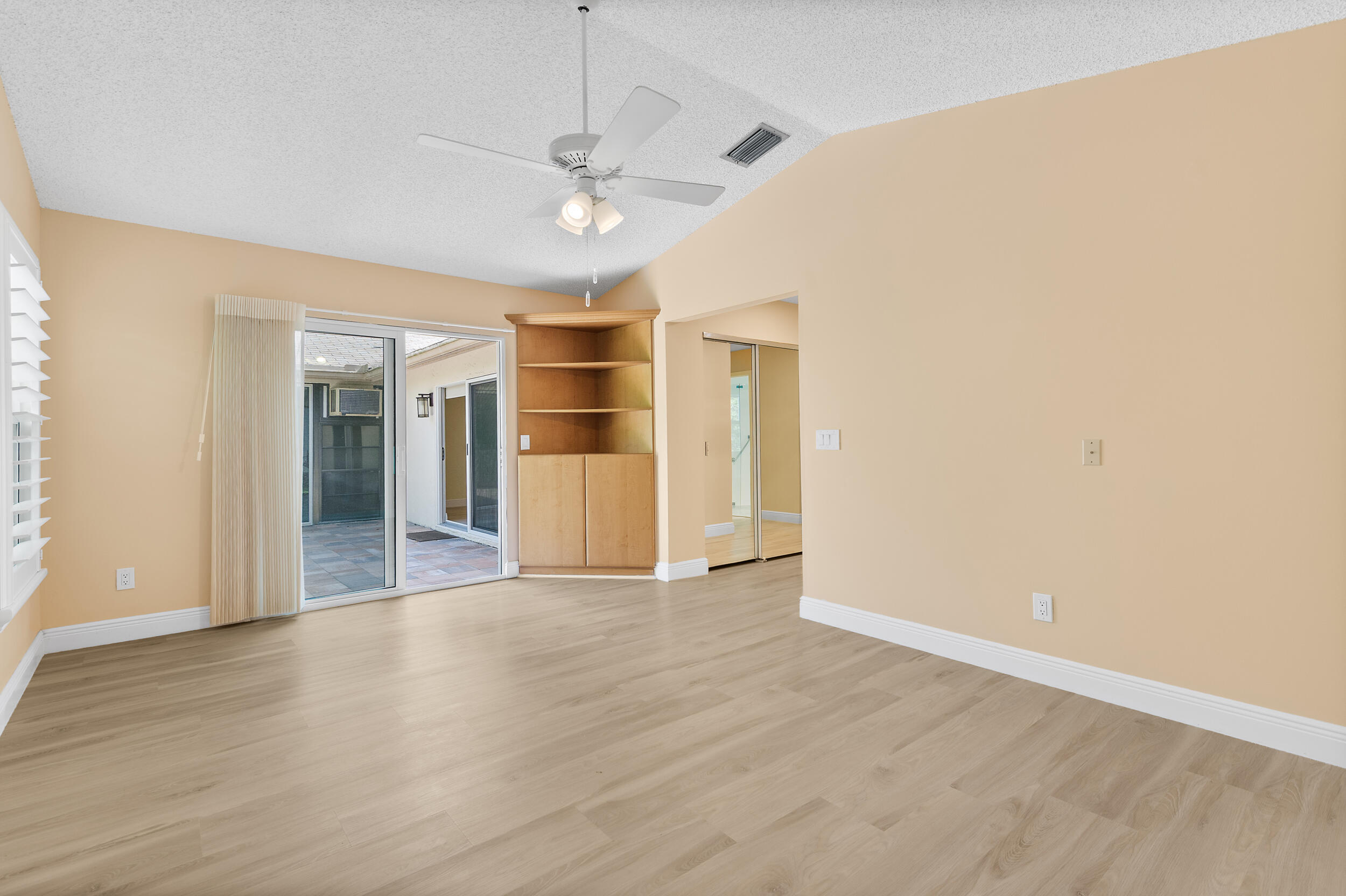 2685 Riviera Drive Delray Beach, FL 33445 - Photo 28 of 48 wooden floor in an empty room with a window