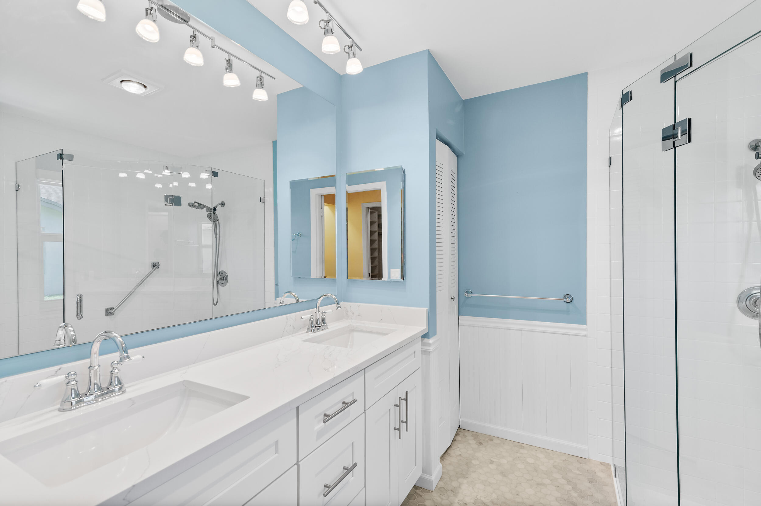 2685 Riviera Drive Delray Beach, FL 33445 - Photo 29 of 48 a bathroom with a double vanity sink and a mirror