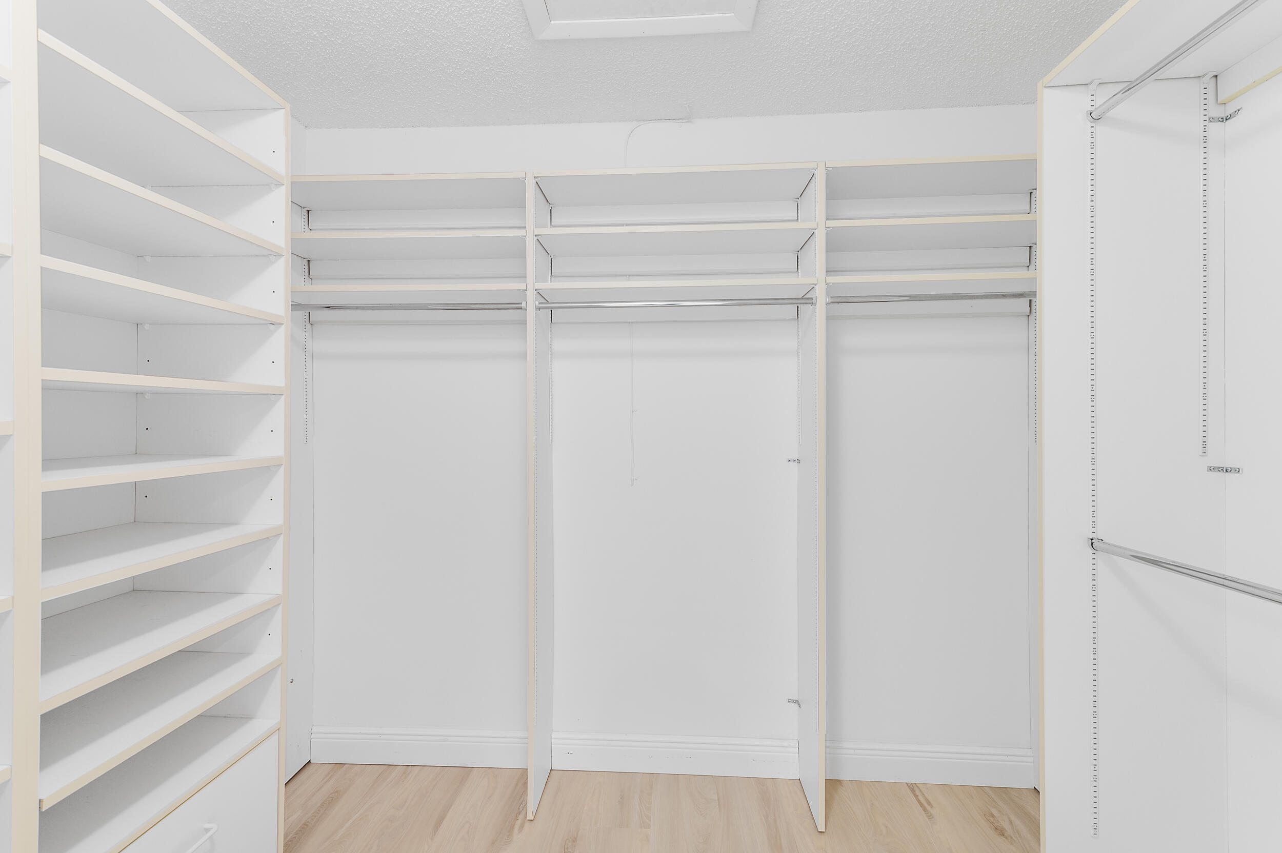 2685 Riviera Drive Delray Beach, FL 33445 - Photo 30 of 48 a view of walk in closet with empty racks