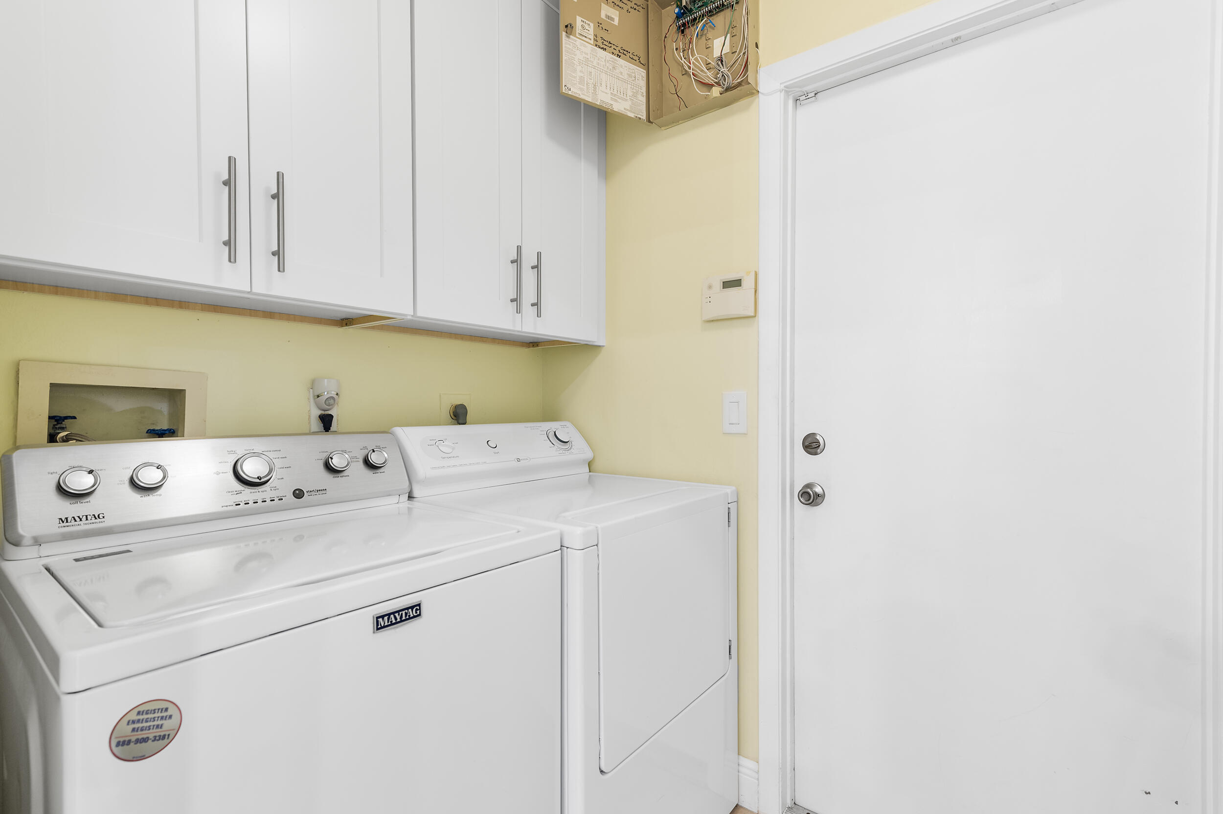 2685 Riviera Drive Delray Beach, FL 33445 - Photo 31 of 48 a utility room with dryer and washer