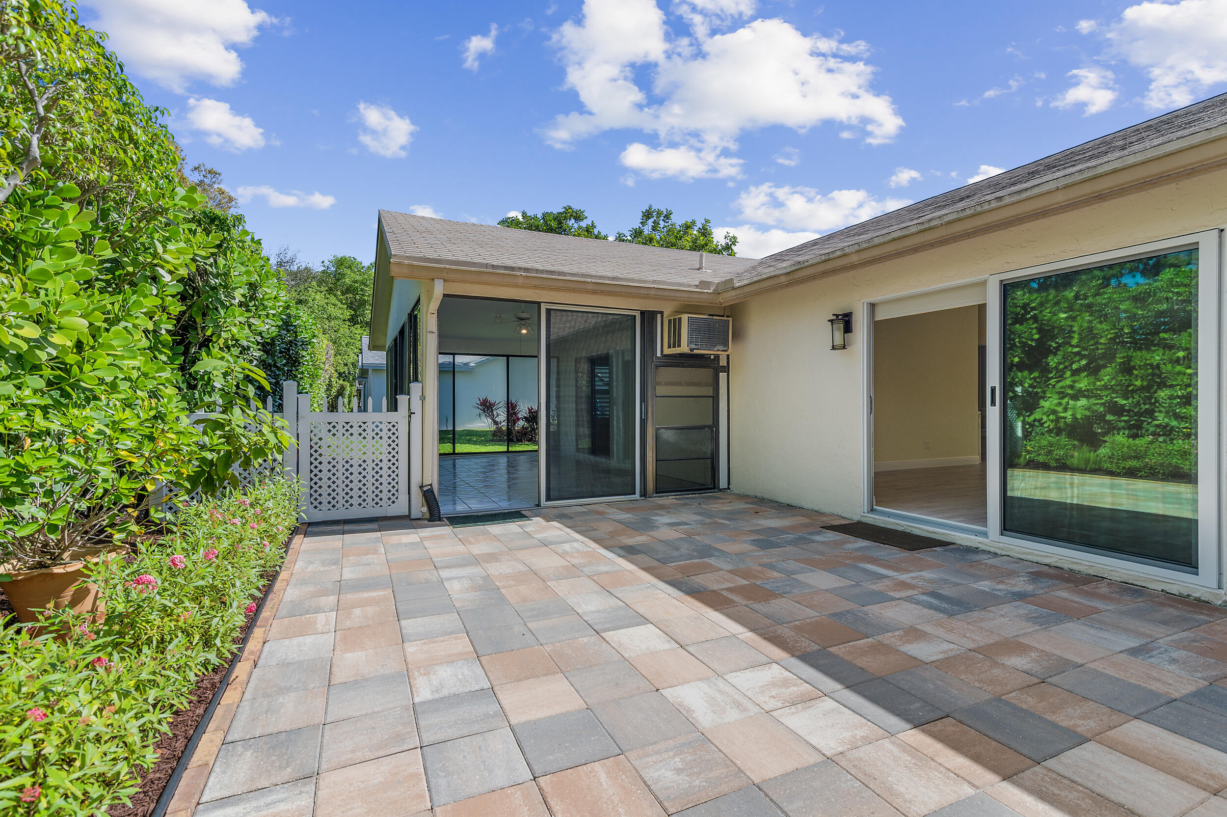 2685 Riviera Drive Delray Beach, FL 33445 - Photo 33 of 48 a view of a porch with a garden
