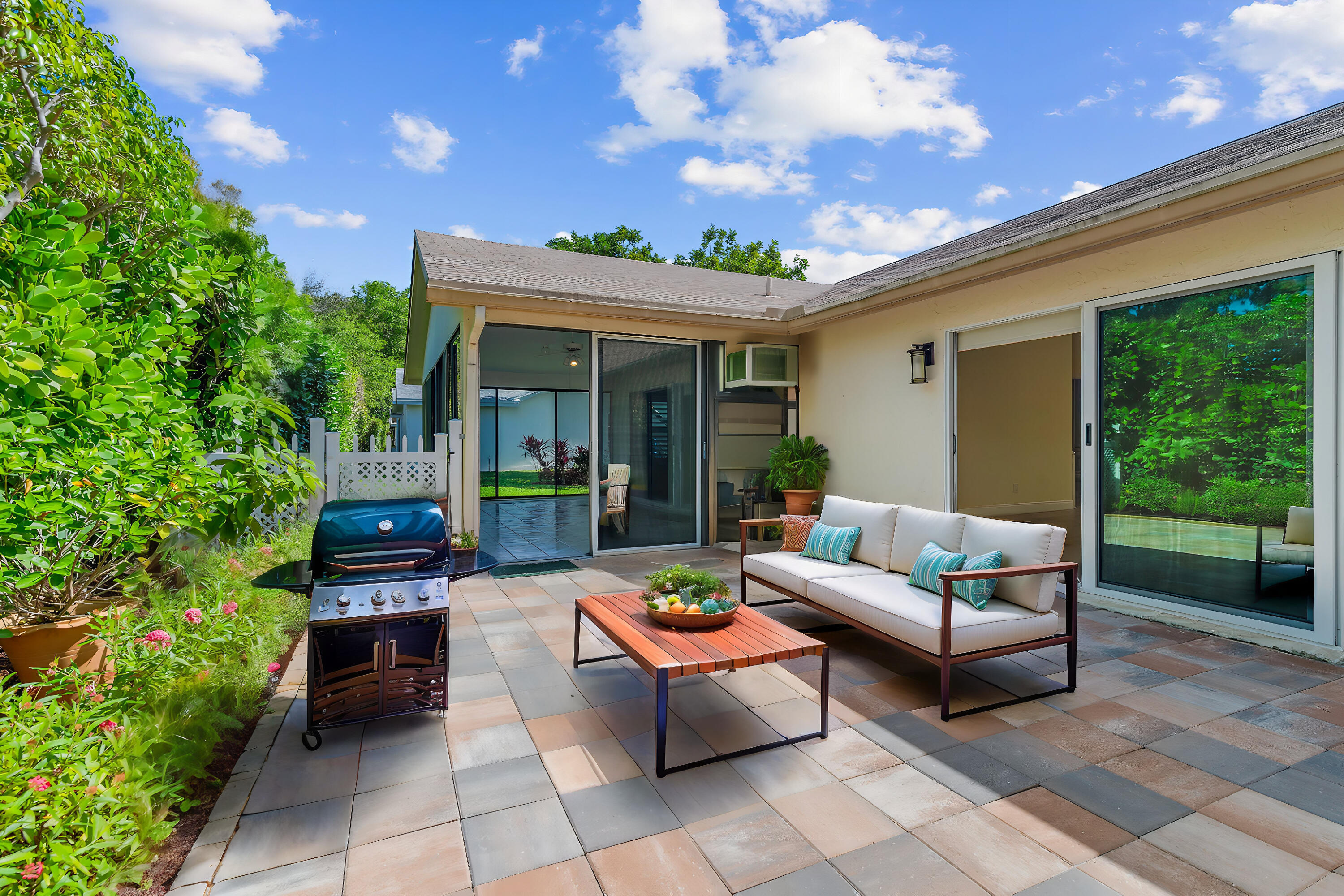 2685 Riviera Drive Delray Beach, FL 33445 - Photo 34 of 48 a outdoor living space with furniture and garden view