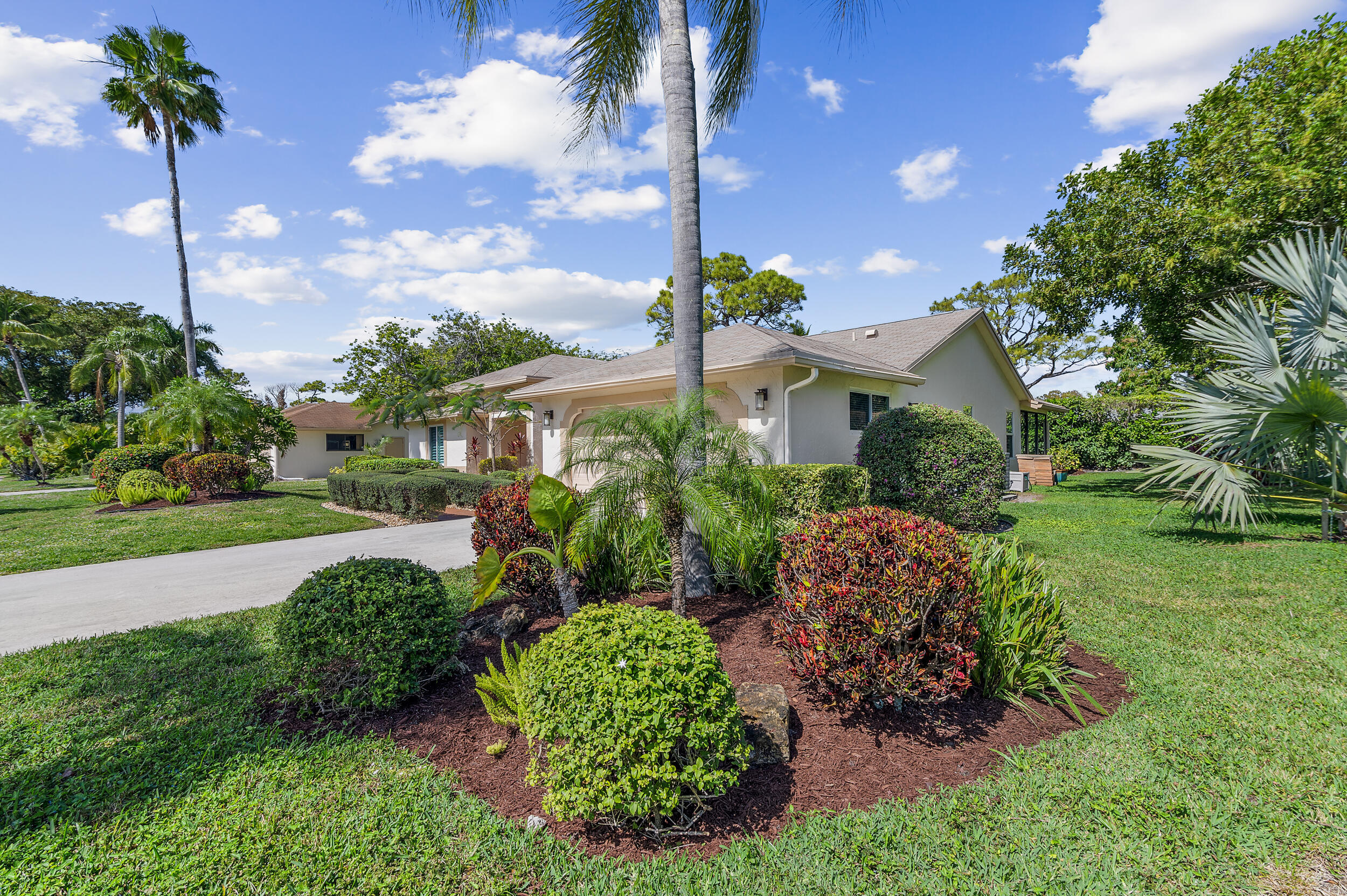 2685 Riviera Drive Delray Beach, FL 33445 - Photo 41 of 48 a view of a house with a yard and potted plants