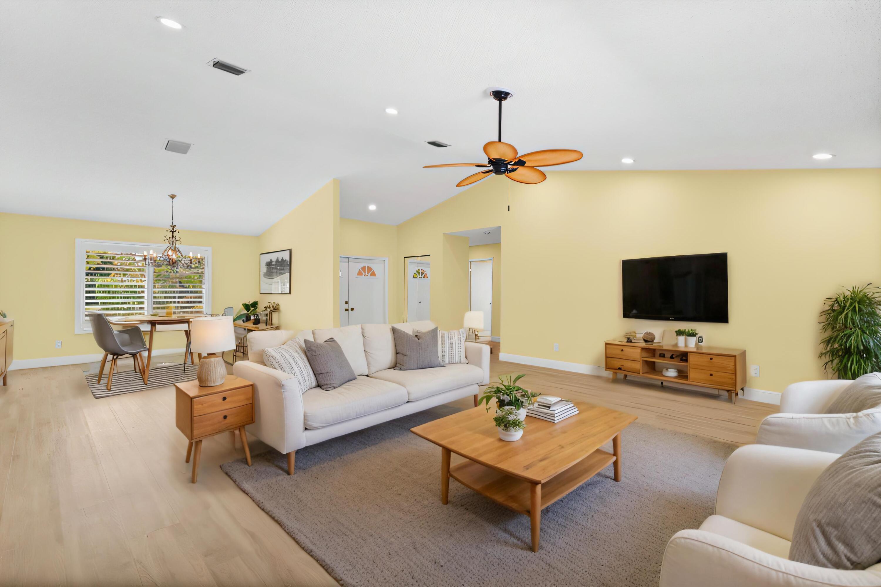2685 Riviera Drive Delray Beach, FL 33445 - Photo 10 of 48 a living room with furniture and a flat screen tv