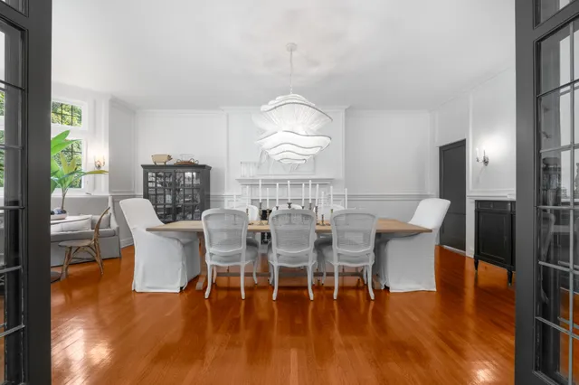 a view of a dining room with furniture window and wooden floor