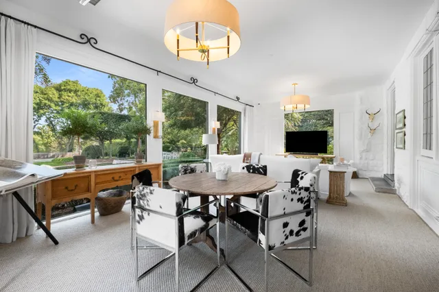 a view of a dining room with furniture window and outside view