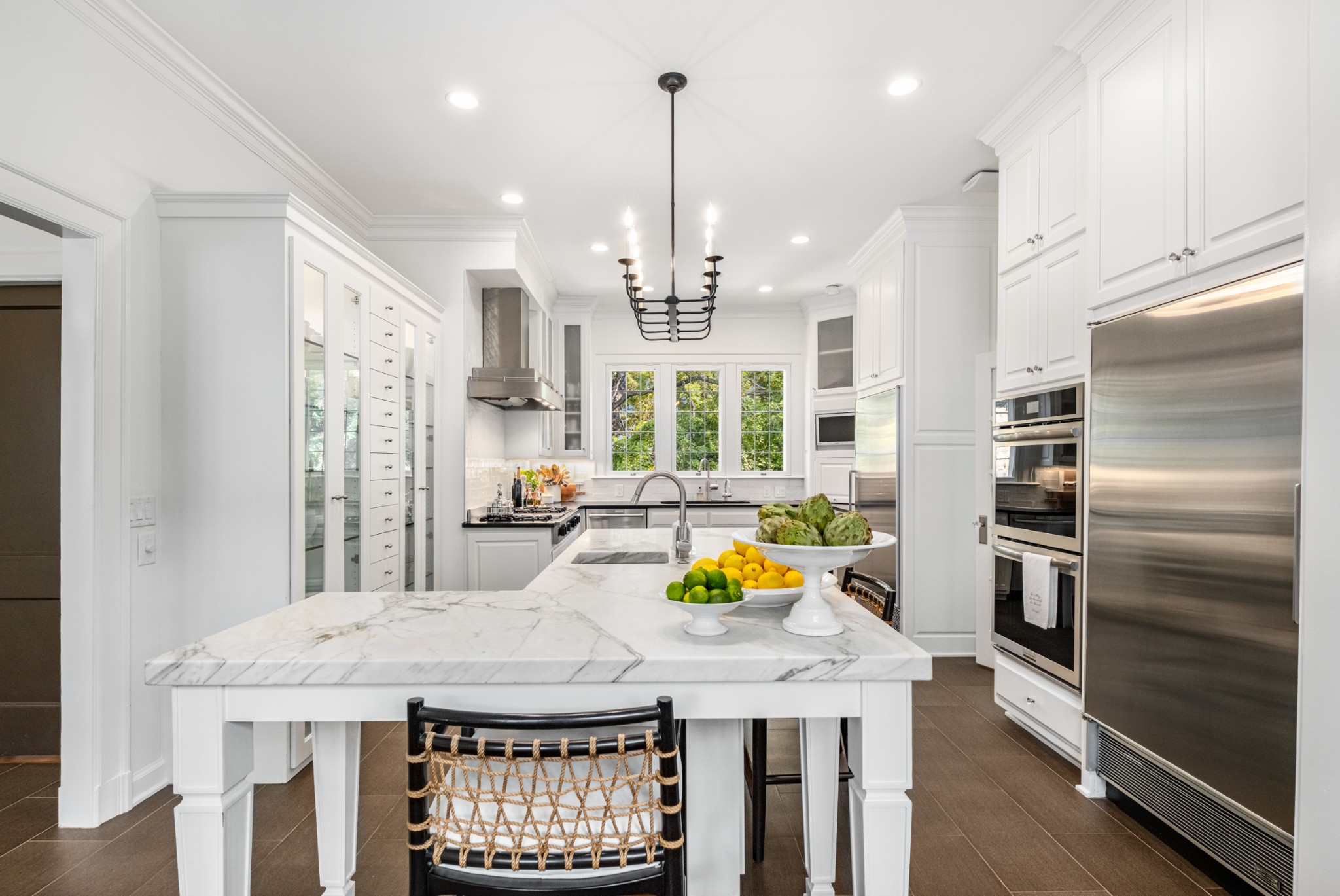 3800 Woodlawn Drive Nashville, TN 37215 - Photo 27 of 43 a kitchen with a refrigerator a stove a oven and a sink with wooden floor