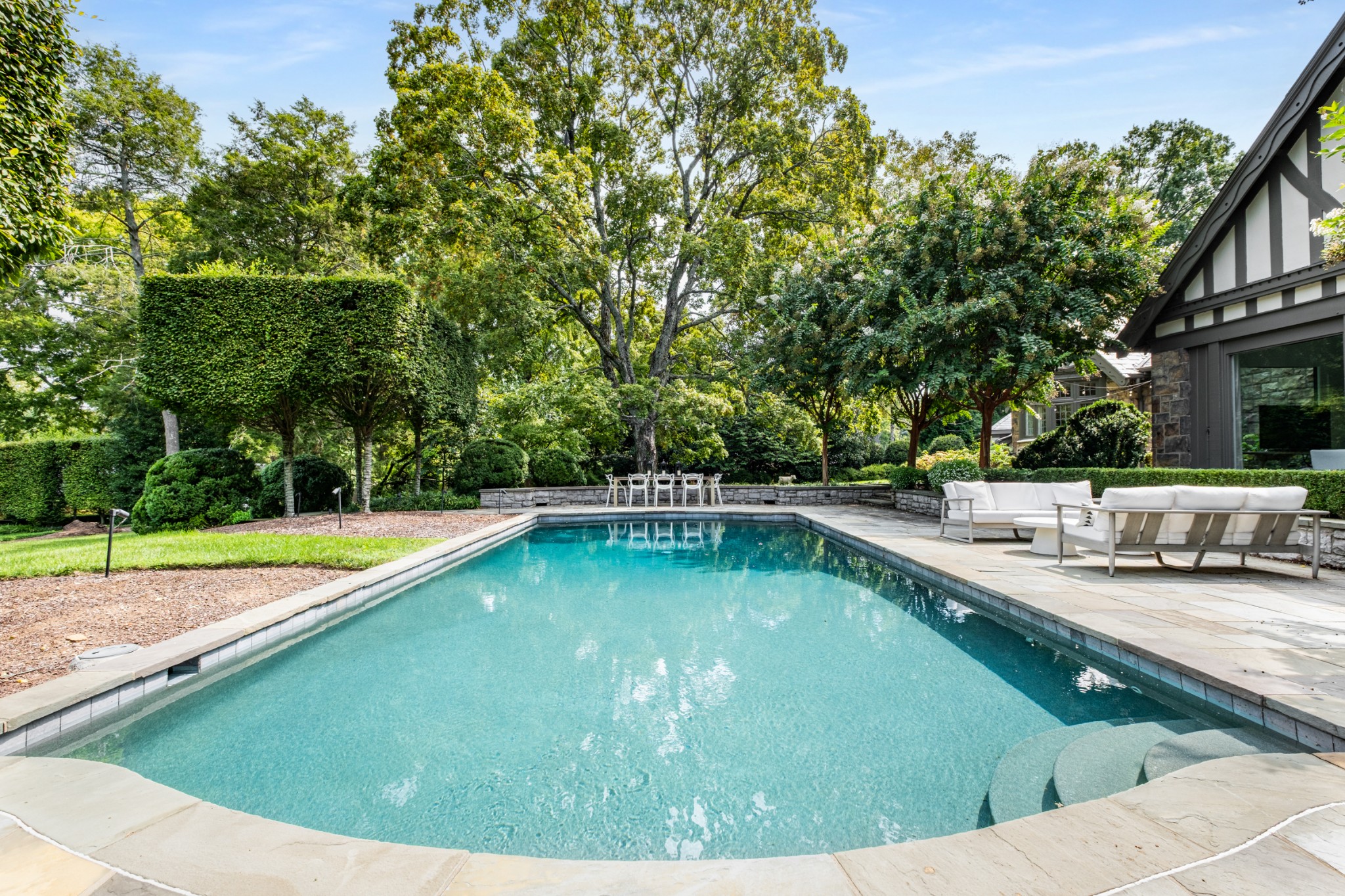 3800 Woodlawn Drive Nashville, TN 37215 - Photo 36 of 43 a view of a swimming pool with a lounge chair