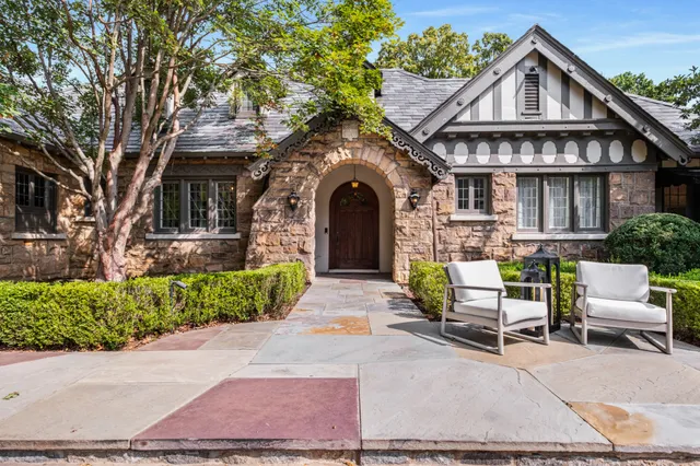 a front view of a house with garden