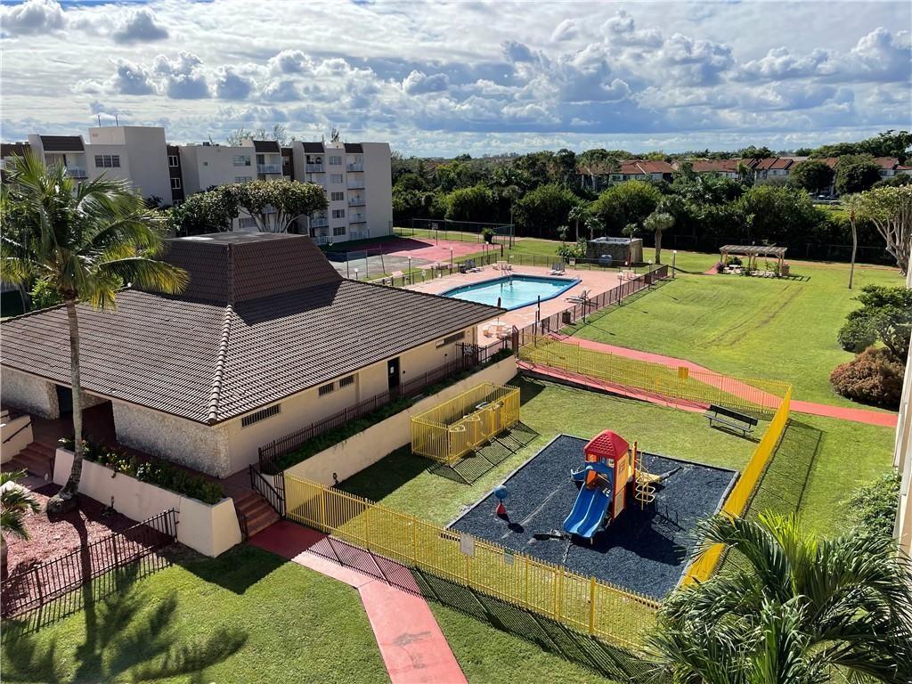 6950 Northwest 186th Street, Unit 2510 Hialeah, FL 33015 - Photo 11 of 19 a view of a backyard with sitting area