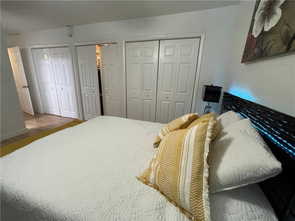 6950 Northwest 186th Street, Unit 2510 Hialeah, FL 33015 - Photo 13 of 19 a bedroom with a bed and a window