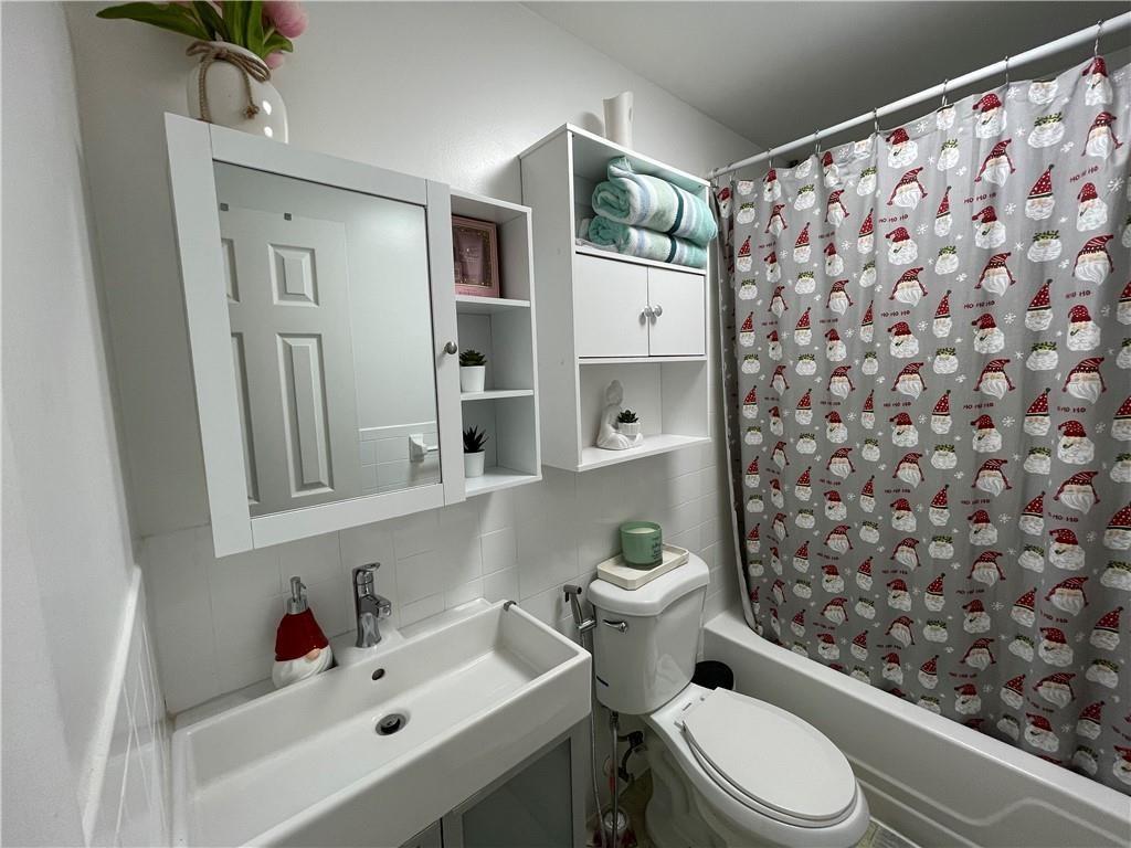 6950 Northwest 186th Street, Unit 2510 Hialeah, FL 33015 - Photo 15 of 19 a bathroom with a sink toilet and shower