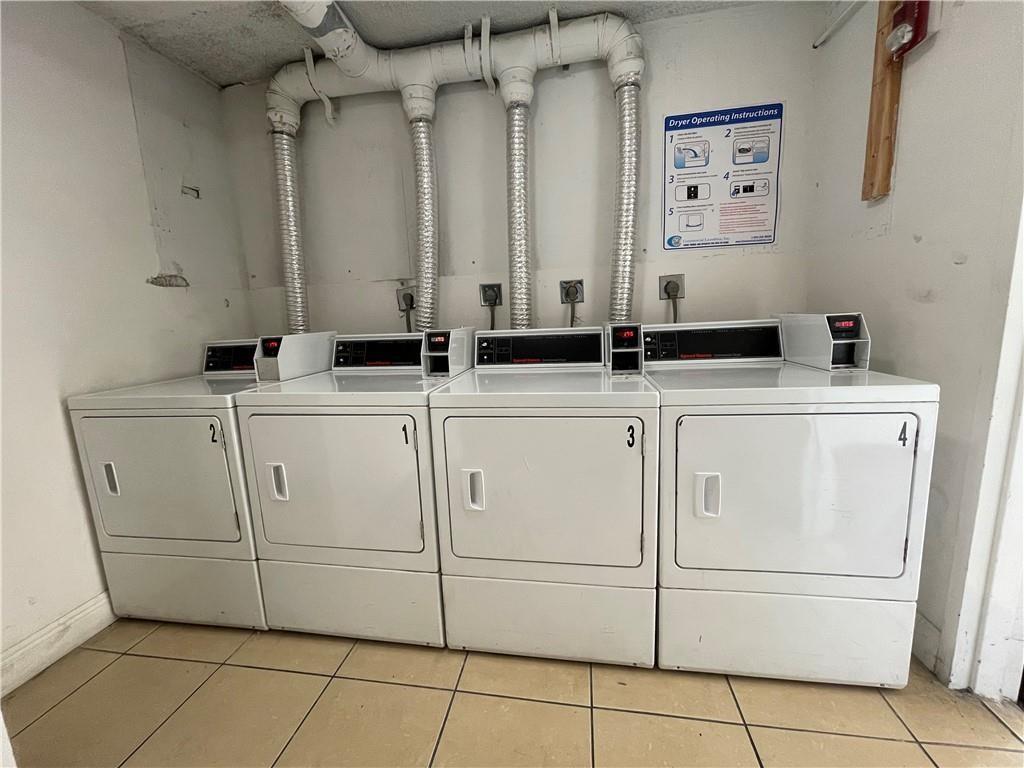 6950 Northwest 186th Street, Unit 2510 Hialeah, FL 33015 - Photo 17 of 19 a utility room with dryer and washer
