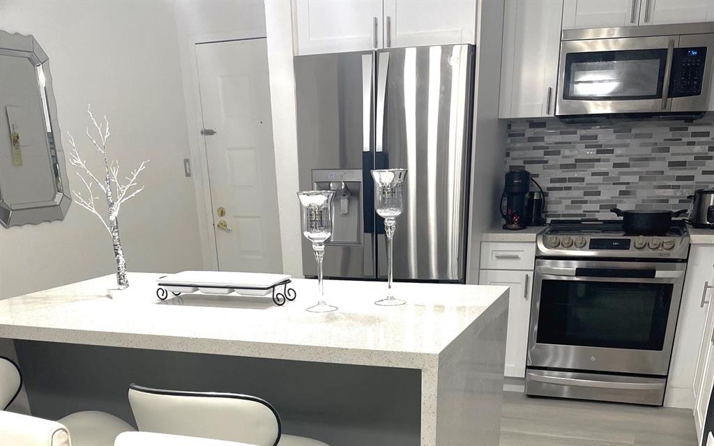 6950 Northwest 186th Street, Unit 2510 Hialeah, FL 33015 - Photo 6 of 19 a bathroom with a sink and a stainless steel appliances