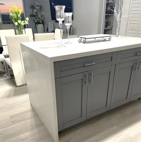 a dining table with a sink and a mirror