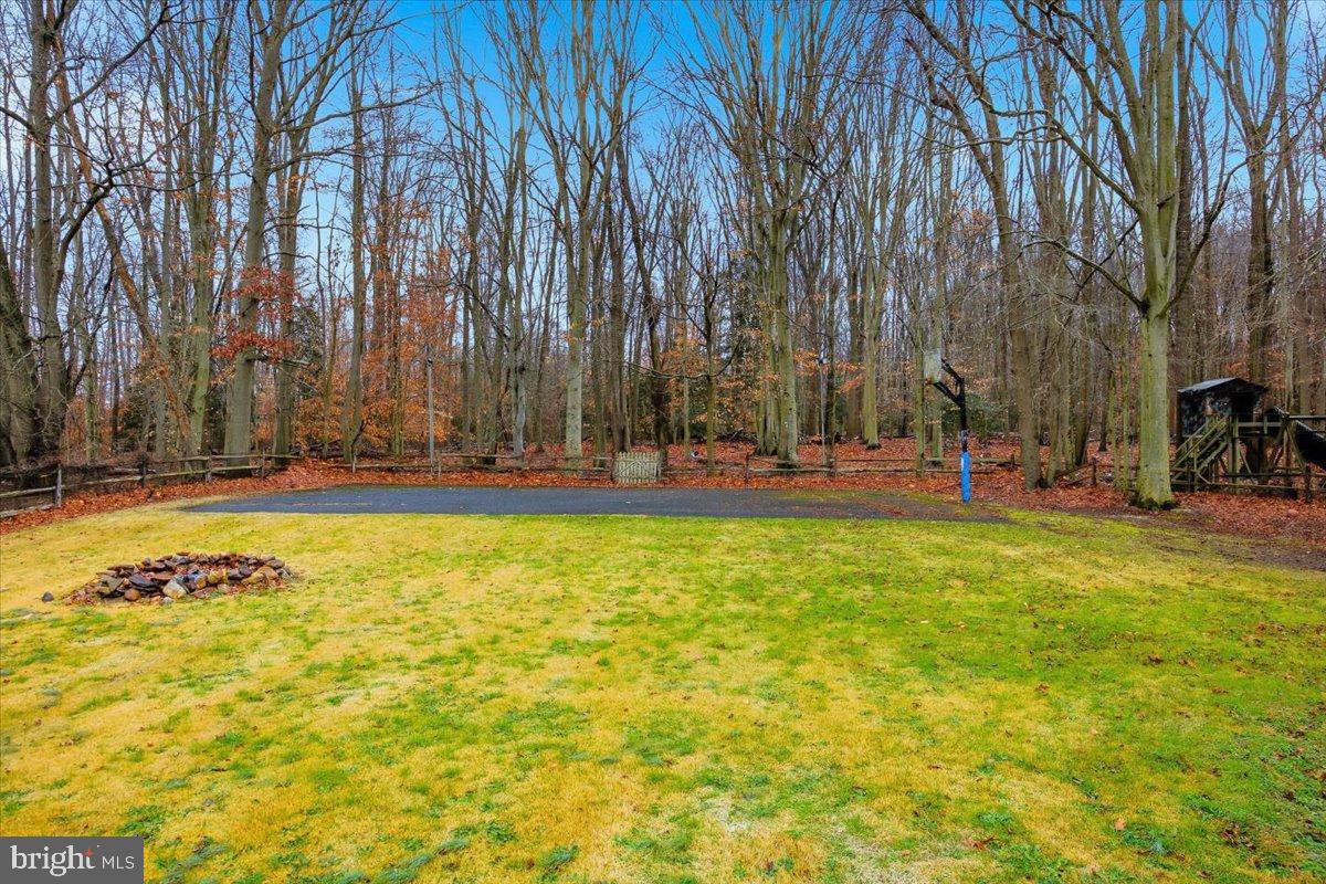 1518 Commissioners Road Mullica Hill, NJ 08062 - Photo 11 of 35 a view of outdoor space with garden and trees