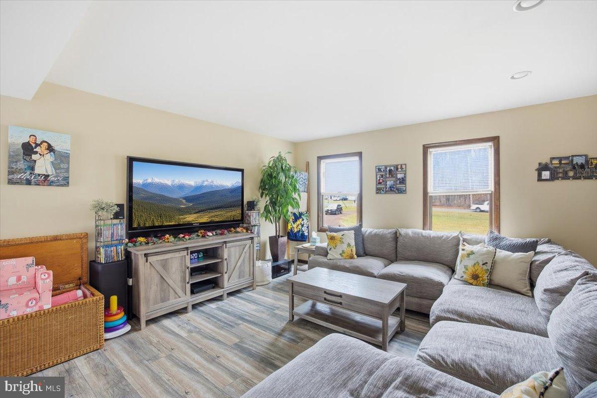 1518 Commissioners Road Mullica Hill, NJ 08062 - Photo 12 of 35 a living room with furniture and a flat screen tv