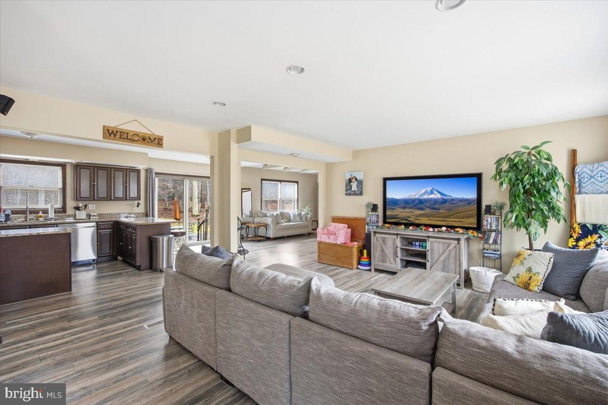 1518 Commissioners Road Mullica Hill, NJ 08062 - Photo 13 of 35 a living room with furniture and a flat screen tv